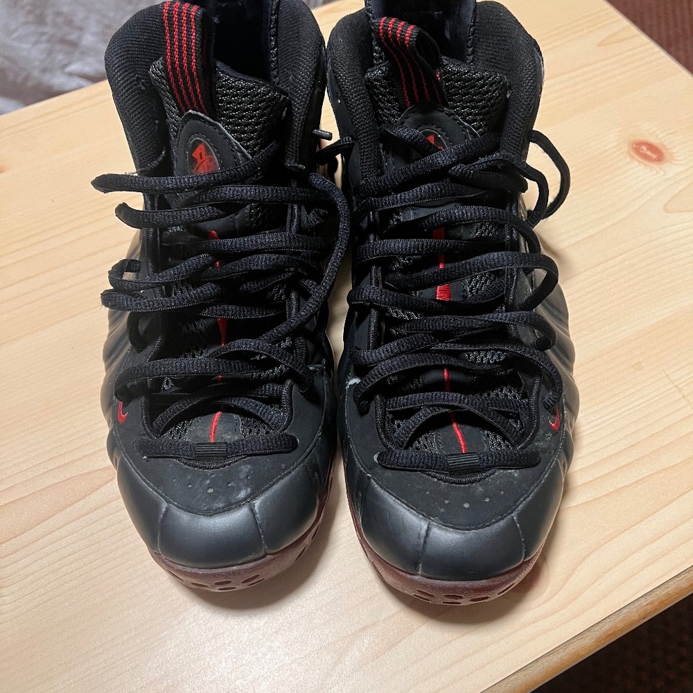 +1 This is a Nike Air Foamposite One "Cough Drop" in black and varsity